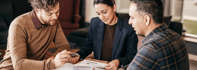 International business executives reviewing Australia foreign investment approval documents with FIRB framework overview