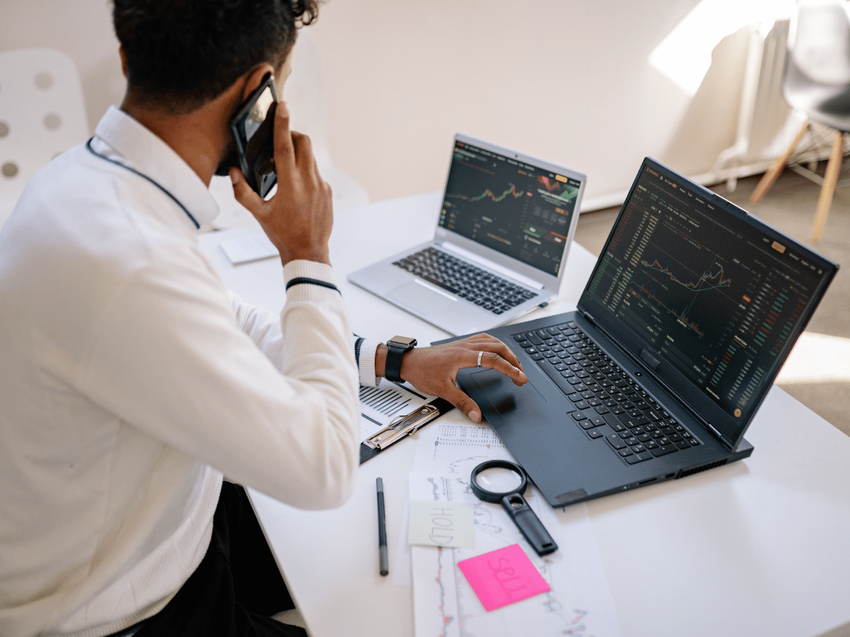 Business professional analyzing Australian stock market performance on a large financial trading screen during a 2026 market review.