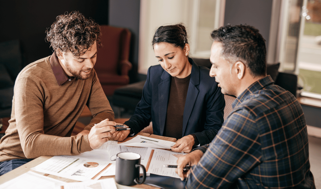 International business executives reviewing Australia foreign investment approval documents with FIRB framework overview